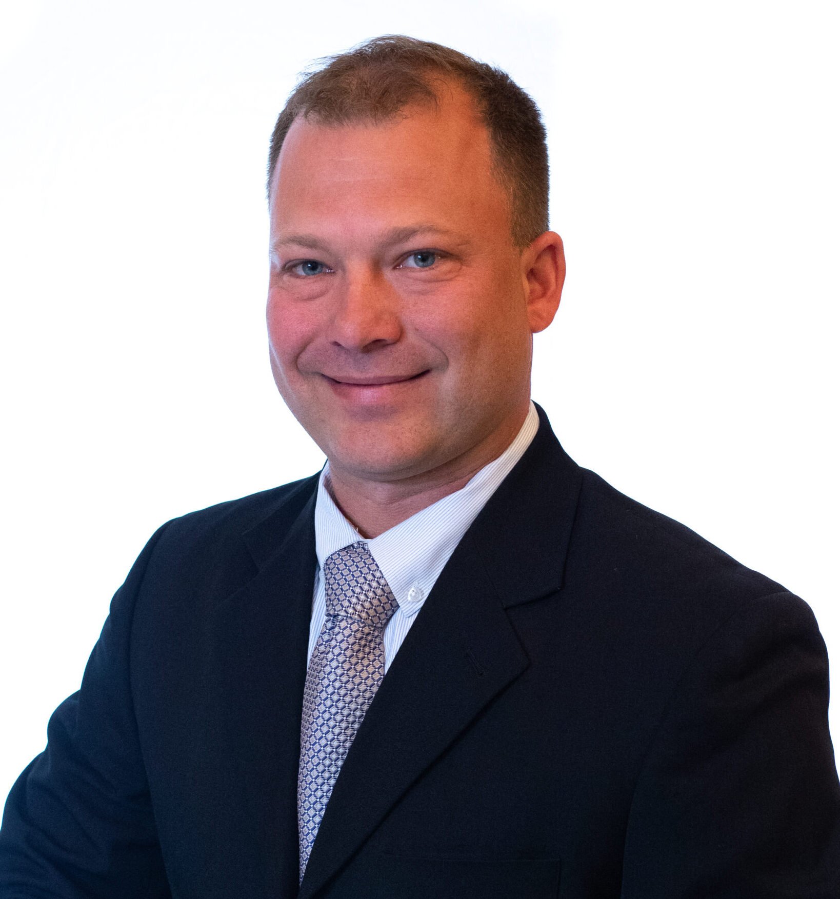 : Vanguard Resources CEO Dustin Powers headshot with white background.